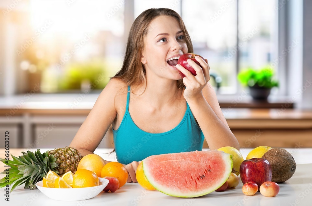 Happy young woman eats fresh fruits, AI generated image Happy young woman eats fresh fruits, AI generated image