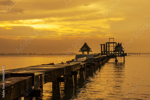 The background of the sea by the evening sea  with natural beauty  sea water  rocks  sky  and fishermen are fishing by the river bank  is a pleasure during travel.