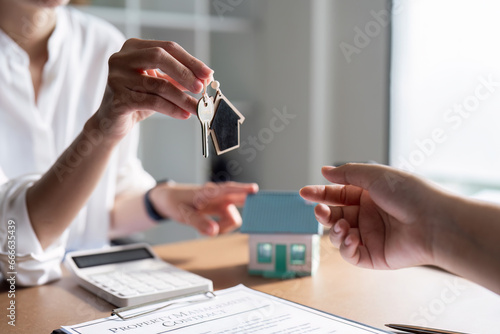 Real Estate Agent explain Property insurance and security concept about house to client before sign contract