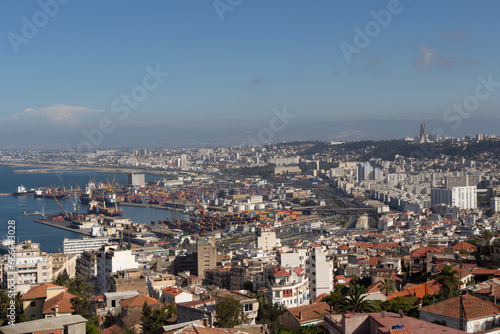 Alger, Algiers, Algeria, 10 07 2023 : Beautiful panorama of the bay of Algiers with the industrial port and the Maqam Echahid monument : Martyrs Monument, in the background.