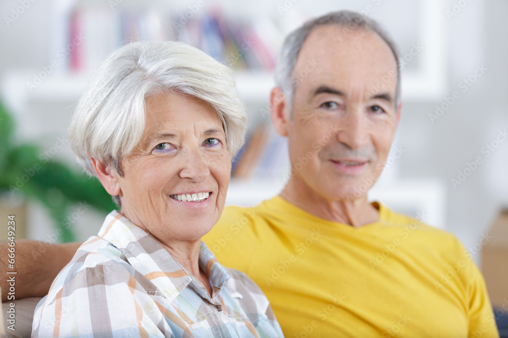 loving senior couple sitting together at home loving senior couple sitting together at home