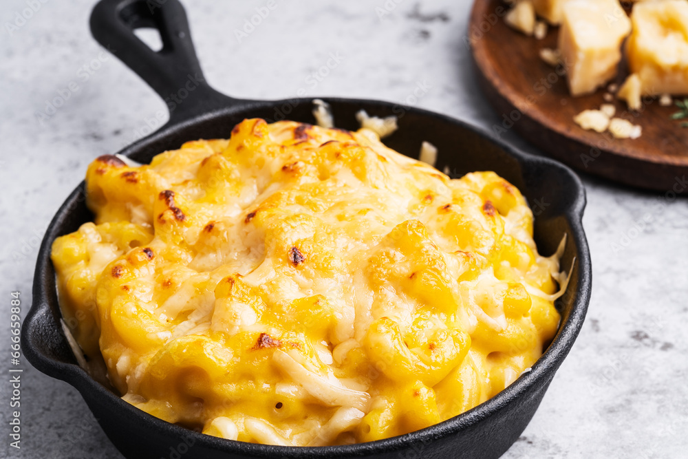 Homemade baked mac and cheese pasta in cast iron pan Homemade baked mac and cheese pasta in cast iron pan