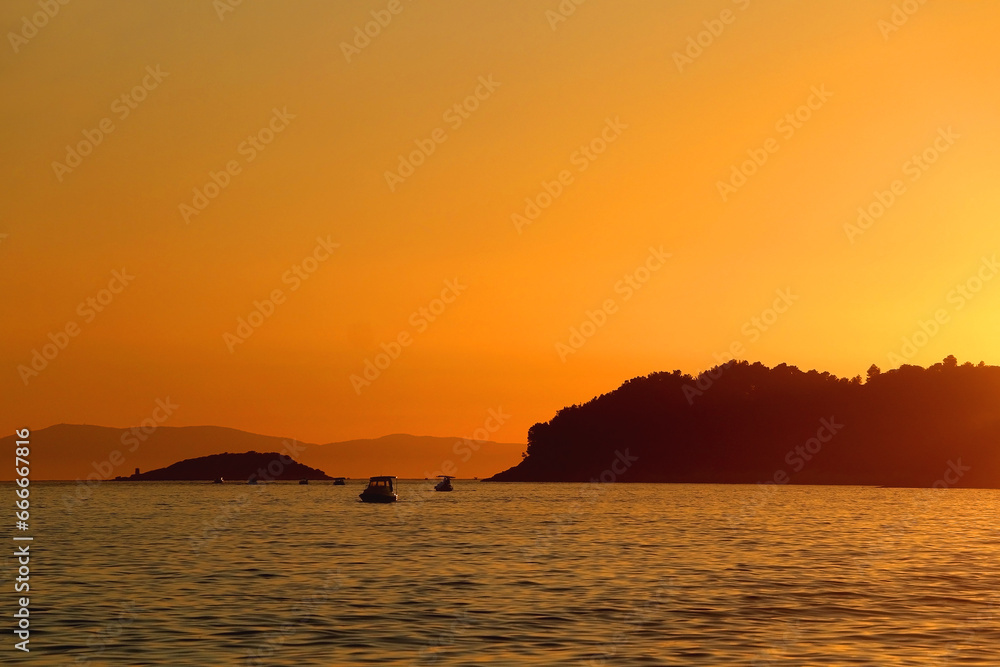 Sailing boat and beautiful sunset in Vela Luka, on island Korcula, Croatia.