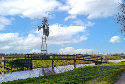 Landscape with windmill photo