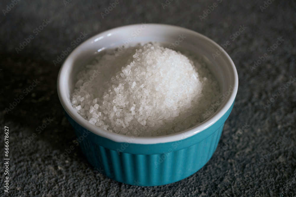 Granulated sugar in a bowl, close-up, culinary raw material