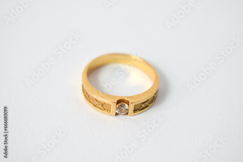 Close Up Golden ring with diamond on isolated white background