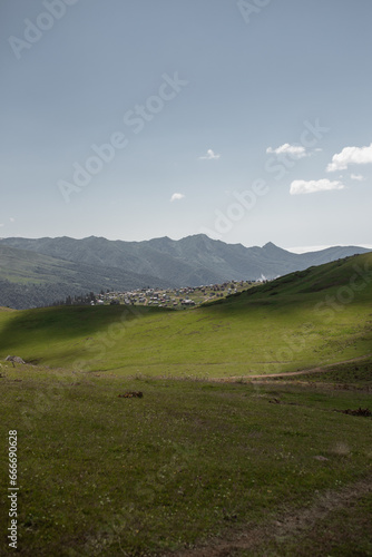 Summer mountain landscape with green hills and clouds  perfect for website design and travel promotion