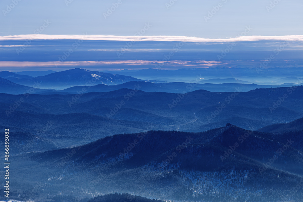 Winter nature panorama of far away blue mountains, picturesque view, aerial tonal perspective, monochrome photo of range mountains and blue sky, hills covered forest, great landscape in Altai - obrazy, fototapety, plakaty 