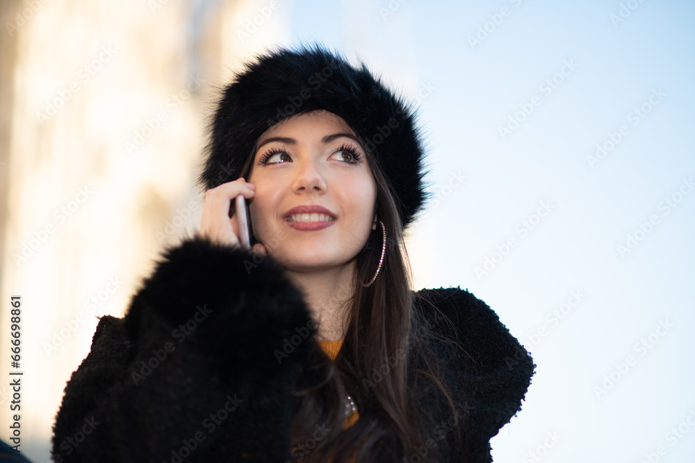 Smiling woman talking on the cellphone Smiling woman talking on the cellphone