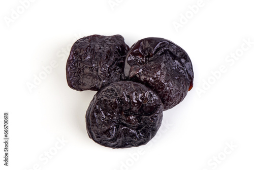 Prunes, dried fruits, close-up, isolated on white background.