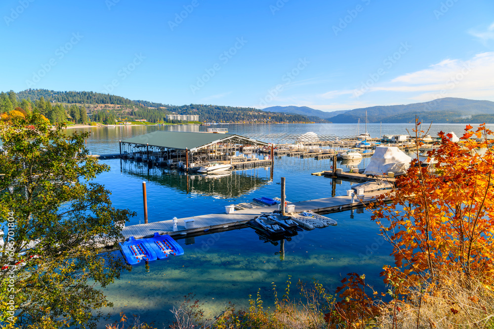 View from the Tubbs Hill hiking trail of the Sanders Beach lakefront community of homes, the sandy beach, and 11th Street Marina along the lake in Coeur d'Alene, Idaho USA at autumn.