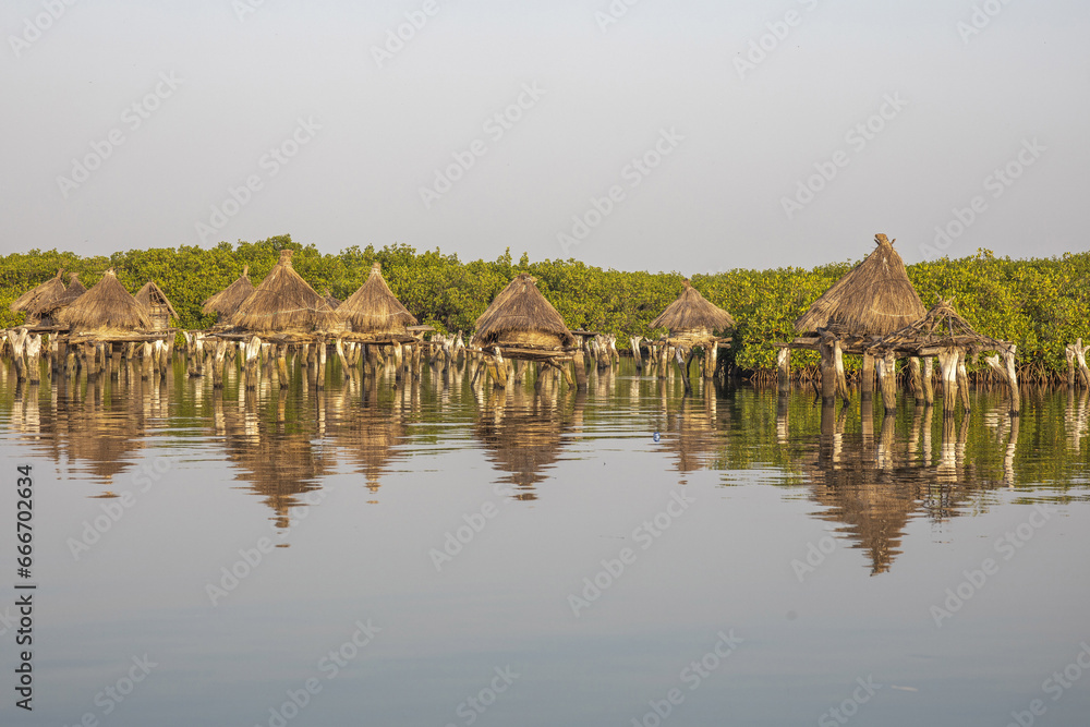 Ancient granaries on an island among mangrove trees, Joal-Fadiouth, Senegal Ancient granaries on an island among mangrove trees, Joal-Fadiouth, Senegal