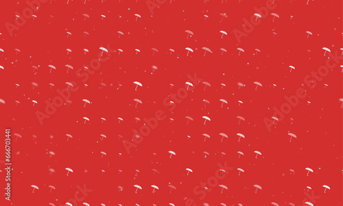 Seamless background pattern of evenly spaced white umbrella symbols of different sizes and opacity. Vector illustration on red background with stars
