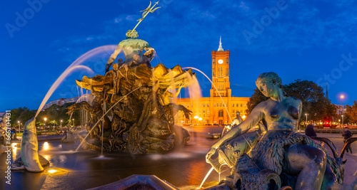 View of Rotes Rathaus (Town Hall) and Neptunbrunnen fountain at dusk, Panoramastrasse, Berlin, Germany photo