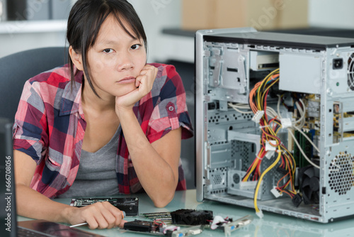 upset engineer woman ready to fix hard disk