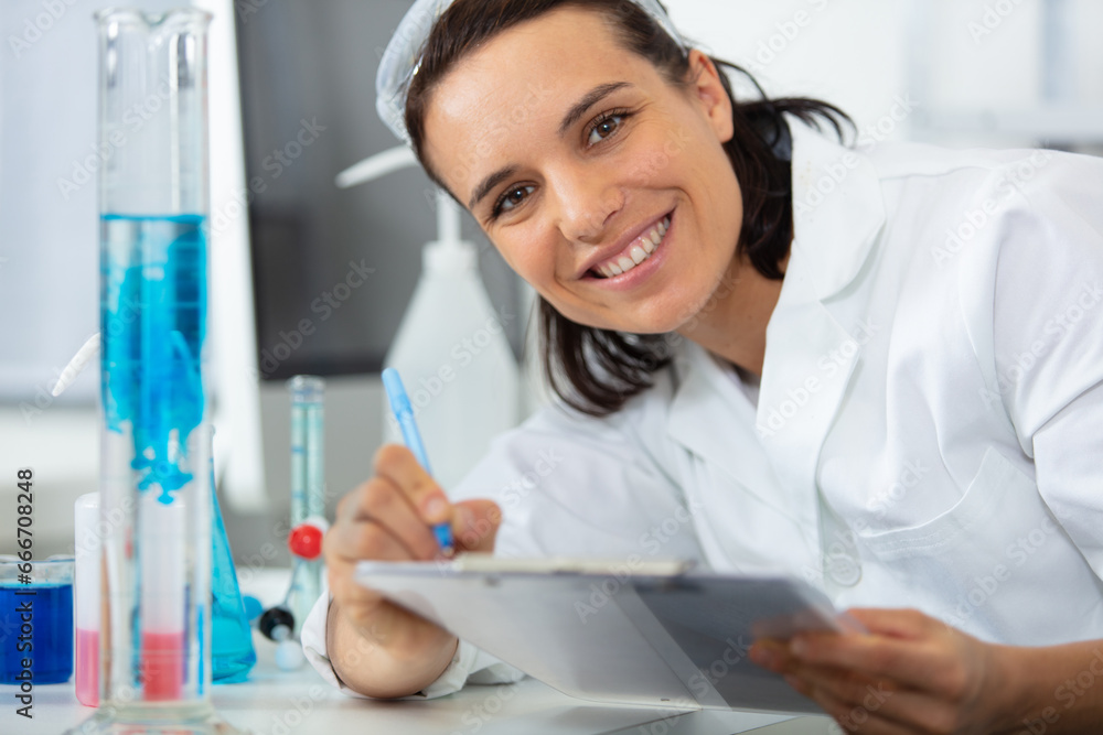 female research scientist with a clipboard female research scientist with a clipboard