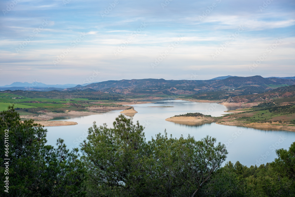 Landscape of Gobrantes and Guadalhorce water reservoir dam at sunset, Andalusia, Spain Landscape of Gobrantes and Guadalhorce water reservoir dam at sunset, Andalusia, Spain