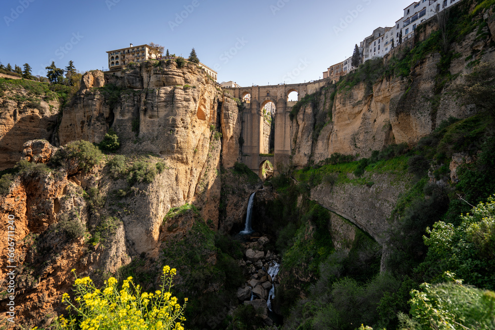 View with beautiful bridge and waterfall, a traditional white village, Ronda, Pueblos Blancos, Andalusia, Spain View with beautiful bridge and waterfall, a traditional white village, Ronda, Pueblos Blancos, Andalusia, Spain