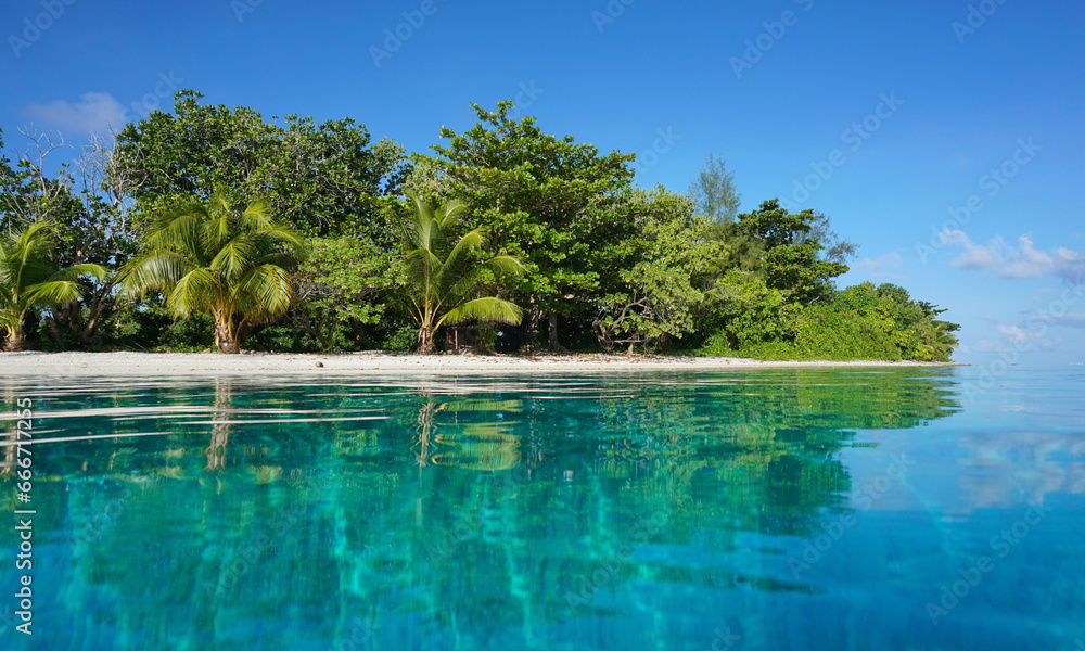 Tropical islet in the lagoon of Huahine island seen from sea surface, natural scene, French Polynesia, south pacific, Society Islands - obrazy, fototapety, plakaty 