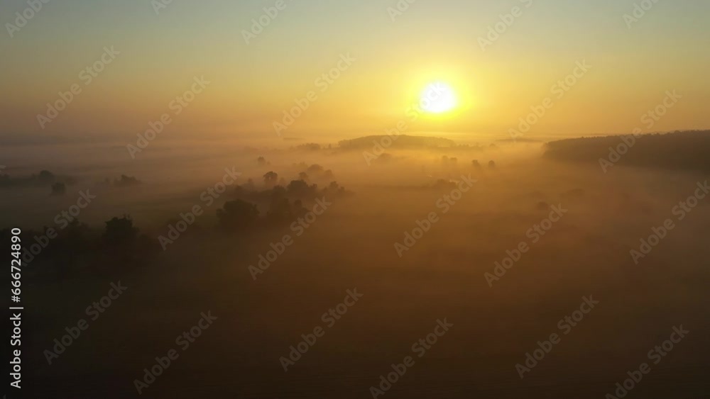 Fog morning over the plain and river floodplain of the meadow near a rural village with a house, aerial 4K view landscape. Flight over a typical German village in fog Fog morning over the plain and river floodplain of the meadow near a rural village with a house, aerial 4K view landscape. Flight over a typical German village in fog