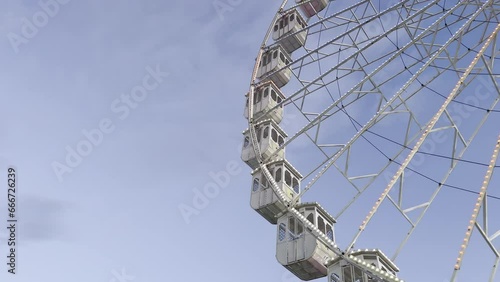 A vintage ferris wheel spinning at sunset