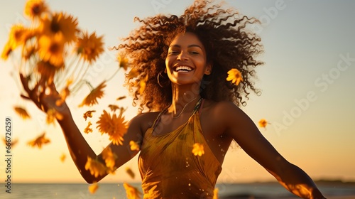 On February 2nd, a black woman celebrates the Yemanja festival by tossing flowers on the beach, a tradition in Brazil.
