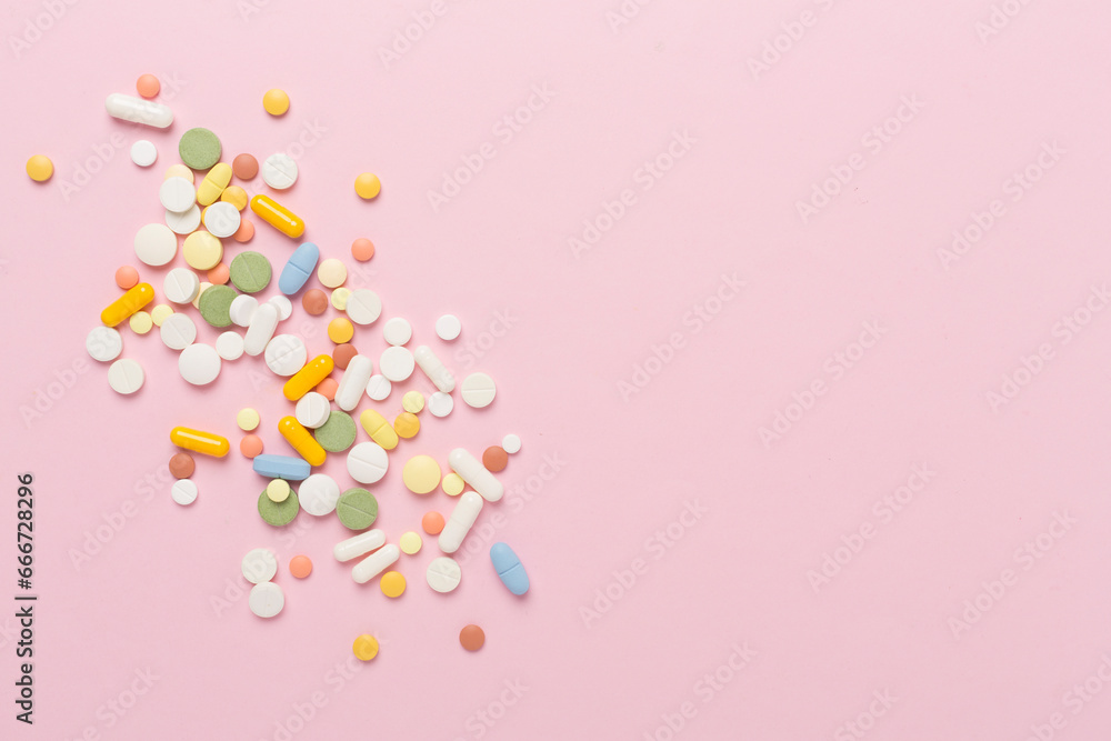 Different medical pills and capsules on color background, top view Different medical pills and capsules on color background, top view