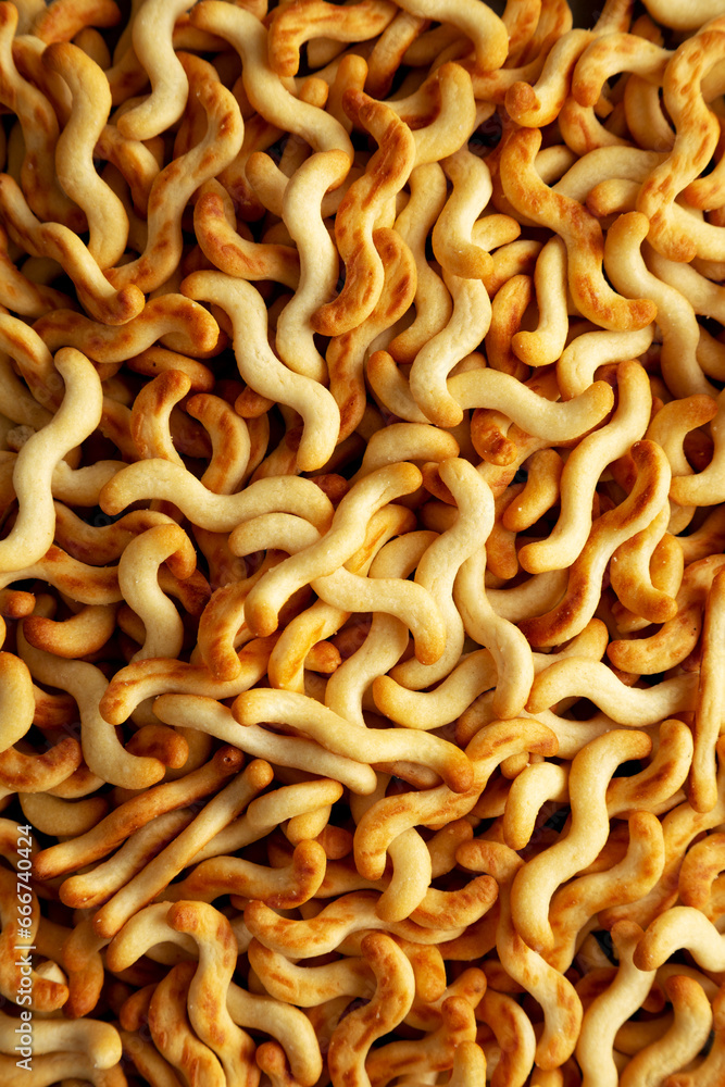 Crunchy Organic Mini Crackers in a Bowl, top view. Flat lay, overhead, from above.