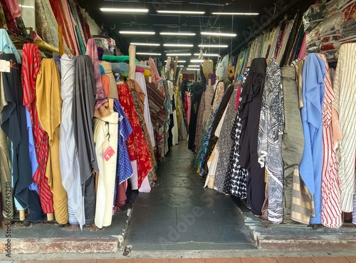 Rolls of fabric on display at a fabric shop photo