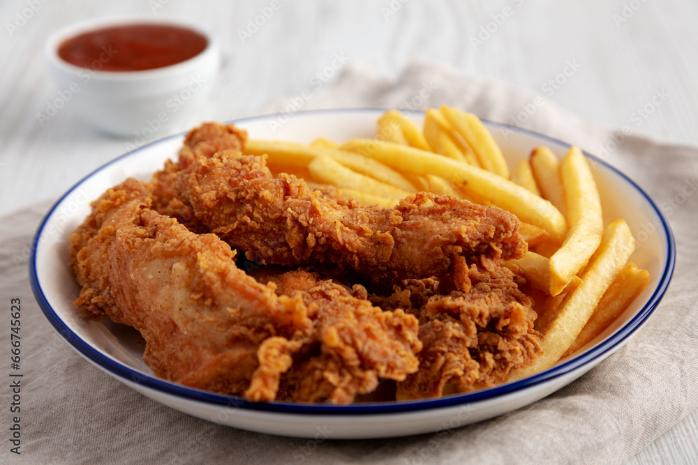 Crispy Chicken Strips with French Fries and Sour-Sweet Sauce Crispy Chicken Strips with French Fries and Sour-Sweet Sauce
