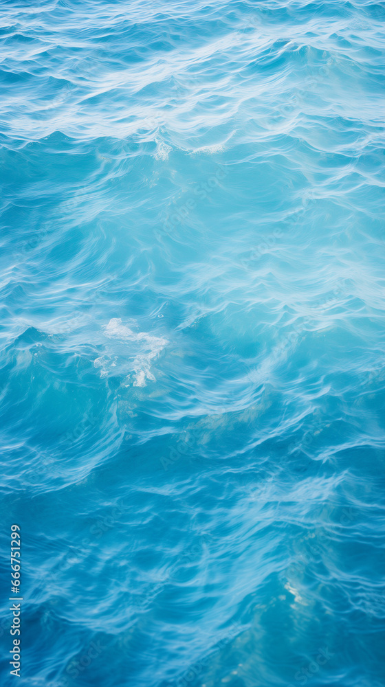 Tranquil ocean surface, showcasing gentle ripples that dance across the serene blue canvas. The subtle interplay of light and movement evokes a sense of peace, making it ideal for relaxation content.