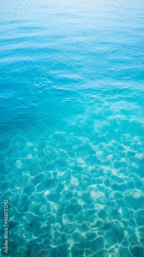Clear, turquoise waters, serene ocean vibes, sunlit ripples, perfect for relaxation-themed content, summer aesthetics.