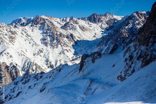 View of the mountains near Shymbulak Ski Resort. Snow Mountains. Almaty. Ile-Alatau National Park. Kazakhstan.