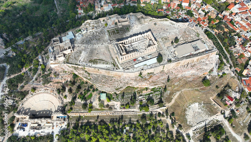 Aerial drone cinematic shot above unique Acropolis hill, the Parthenon, Odeon of Herodus Atticus and theatre of Dionysus, Athens historic centre, Attica, Greece photo