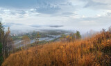 Morning fog on country foothills above Opir and Stryi rivers, and slopes of the Carpathian Mountains in far, Ukraine.