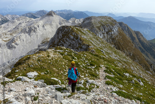 Adult Woman Hiker Hike Between Krn and Batognica Mountain on a very scenic Alpine trail in Julian Alps - Slovenia