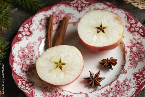 Halved apple with a star in the middle, with spices