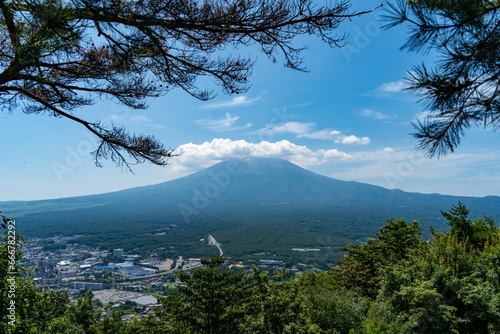 Mount Fuji in Summer clear sky with clouds at the peak