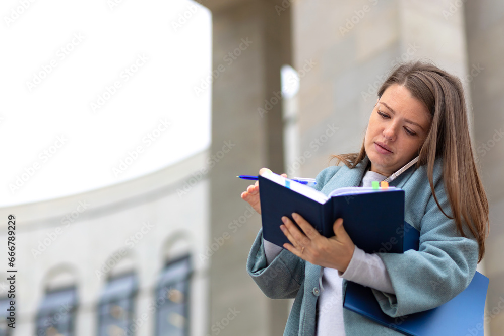 busy businessman with folder, documents talking on phone, woman organizer writing note data deadline, in diary, lady in hurry outdoors near business center. copy space, text busy businessman with folder, documents talking on phone, woman organizer writing note data deadline, in diary, lady in hurry outdoors near business center. copy space, text