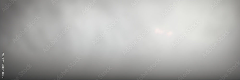 A setting with a neutral gray background that exhibits a delicate gradient A setting with a neutral gray background that exhibits a delicate gradient