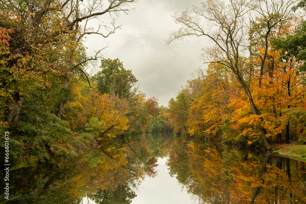Moody morning over Delaware Canal in New Jersey featuring beautiful fall colors