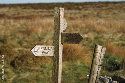 The Pennine Way footpath sign near Pinhaw Beacon Trig Point, Elslack Moor near Lothersdale, North Yorkshire. England, UK photo