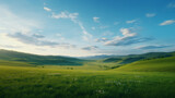 A picturesque landscape with rolling green fields and majestic mountains in the distance