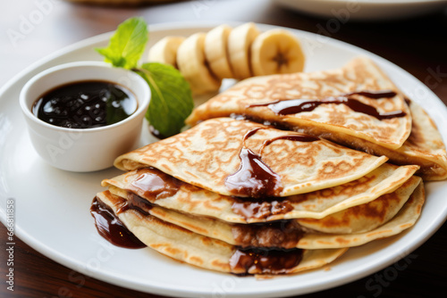 tasty food. pancakes with chocolate and banana. breakfast