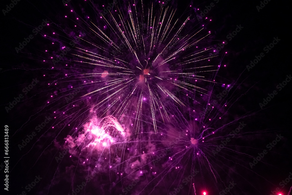 Fireworks explode in the night sky. Selective focus. Fireworks explode in the night sky. Selective focus.