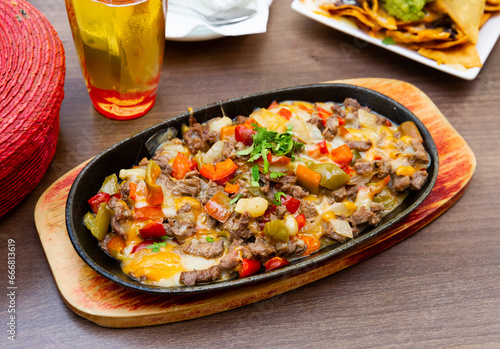 Pan of veal meat roasted with bell pepper and eggs (Alambre de ternera) - dish of Mexican cuisine