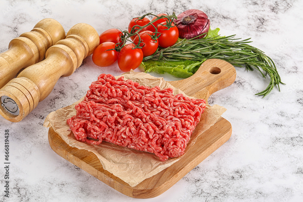 Raw minced beef meat on cutting board Raw minced beef meat on cutting board