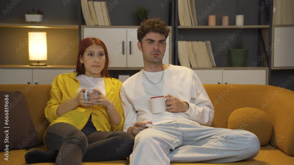 Couple watching horror movie. Couple watching horror movie.