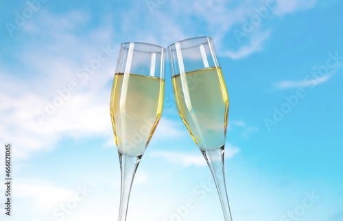 Cheers with beautiful wine glasses on sky background