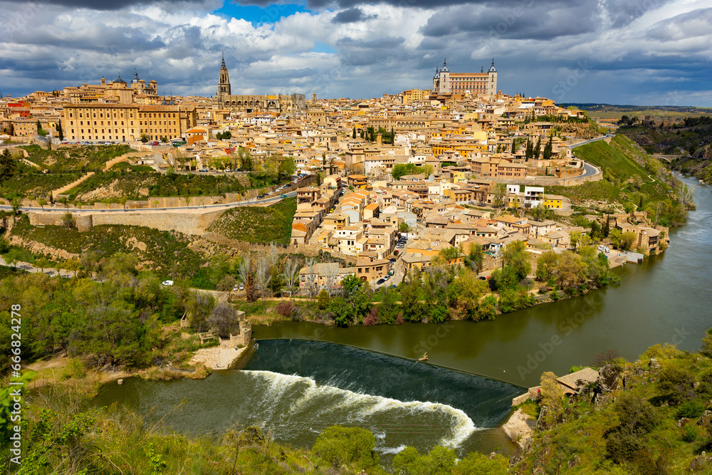 Scenic cityscape of old town of Toledo at bank of Tagus river, central Spain